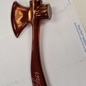 Glass axe from 1932 ruby color. Axe does stand upright